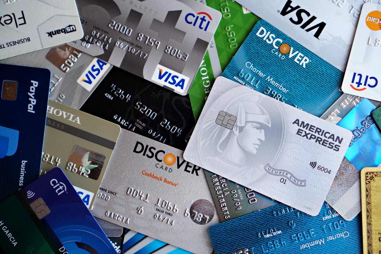 about-us A flat lay of assorted credit and debit cards from various banks. Ideal for finance and banking concepts.